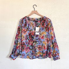 Flowy V-Neck Blouse With Ruffes And Long Sleeves. Vibrant Print V-neck Top For Brunch, Blue V-neck Blouse For Fall, Blue V-neck Blouse For Brunch, Blue Floral Print V-neck Blouse, Blue Vibrant Print V-neck Top, Zara V-neck Printed Tops, Multicolor V-neck Workwear Blouse, Multicolor V-neck Blouse For Work, V-neck Blouse With Vibrant Print For Day Out