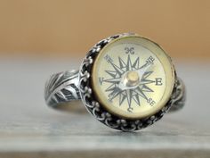 Handmade sterling silver ring with vintage style mini working compass sets in center. Ring hand made to order and is antiqued and lightly polished by hand. Made to order item, current processing time is 5 to 7 business days. Measurement, Compass measures about 14mm in length including bezel setting, made to order item so just choose your preferred size when checking out. Compass Ring, Compass Jewelry, Handmade Sterling Silver Rings, Ring Hand, Engagement Jewelry, Dream Jewelry, Handmade Sterling Silver, Ring Handmade, Unique Rings