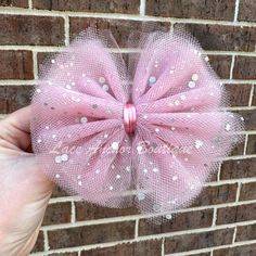 "Outfit your little one in a one-of-a-kind! A handmade Solid Sparkle Tulle Bow or Piggies Set adds a bit of sparkle to any outfit. With glitter pieces in cool colors, they'll be the most stylish toddler on the block! Get ready for the oohs and awws! * 5\" width single bow * 3\" width piggies set * 3\" width mini single bow ** Barrette style clip on 5\" bows. Alligator style clip on all 3\" bows." Tulle Hair Bow, Tulle Hair Bows, Strawberry Outfit, Flower Girl Outfits, Bow Light, Girls Hair Bow, Tulle Bow, Light Mauve, Bow Barrette