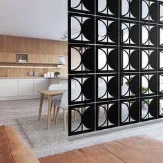 a room divider with black circles on it