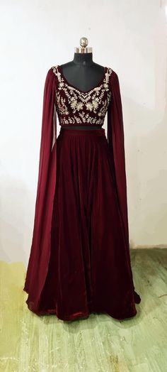 An absolutely gorgeous hand embroidered  velvet blouse paired with a velvet skirt and georgette dupatta attached to the sleeves Choose a standard size or you can share custom measurements.  I'll share the measurements sheet with you.  Please contact us for other colors or any customizations. Maroon Velvet Lehenga, Hand Embroidery Blouse, Plain Blouse Designs, Embroidery Blouses, Velvet Lehenga, Georgette Dupatta, Velvet Blouse, Embroidered Velvet, Plain Blouse