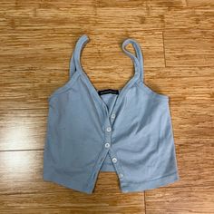 Brandy Melville Baby Blue Button Up Tank Top Condition: Never Used No Longer Sold In Store Or Online Size: One Size (Fits Small) Brand: Brandy Melville Open To Offers #Brandymelville #Y2k #Casual #Tanktop #Buttonup Cute Blue Tops With Button Closure, Cute Blue Button-up Top, Blue Button-up Top With Snap Buttons, Blue Snap Button-up Tops, Blue Cotton Tops With Snap Buttons, Light Blue Buttoned Top For Spring, Light Blue Cotton Top With Button Closure, Light Blue Cotton Tops With Buttons, Fitted Light Blue Tops With Button Closure