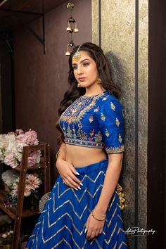 Royal Blue Lehenga Set from Gamila Collection Blue Cutdana Designer Wear Sets, Blue Blouse For Eid Reception, Blue Elegant Blouse For Eid, Blue Raw Silk Sets With Cutdana Details, Blue Raw Silk Sets With Cutdana, Transitional Blue Raw Silk Lehenga, Blue Unstitched Choli For Transitional Season, Blue Sets With Intricate Embroidery In Traditional Drape, Blue Anarkali Blouse With Intricate Embroidery