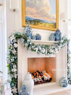 a fireplace decorated with blue and white ornaments