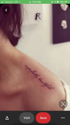 the back of a woman's shoulder with an inscription that reads, i love you