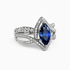 an engagement ring with a blue stone surrounded by diamonds