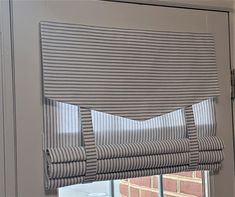 a close up of a window with blinds on it