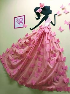 a dress made out of pink paper with butterflies on the wall and a woman's head