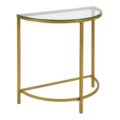 an oval glass table with gold metal frame