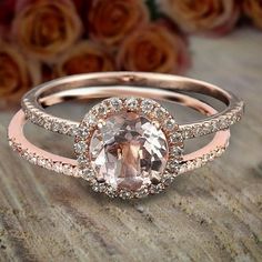 an oval shaped morganite and diamond halo engagement ring