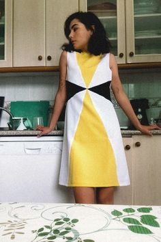 Chic Yellow Color Block Dress, White Retro Sleeveless Dress, White A-line Mini Dress In Mod Style, White Sleeveless Mod Dress, White A-line Mod Dress, Yellow Retro Fitted Dress, Yellow Fitted Retro Dress, Fitted Retro Yellow Dresses, White Sleeveless Mod Mini Dress