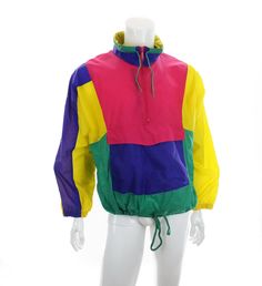 Vintage Ispo windbreaker jacket with a colorblocked design in yellow, green, hot pink, and purple (which appears a bit more bluish in the pics than it is).  100% nylon. Unlined. Machine washable.    This pullover jacket has a half length front zip, standing collar with drawstring ties, three front pockets, drawstring hem, and a hood which can be tucked into the back of the collar.  Overall good vintage condition but does have some small marks / spots as shown, most noticeably on the left sleeve. Spring Multicolor Color Block Windbreaker, Multicolor Hooded Color Block Windbreaker, Multicolor Color Block Hooded Windbreaker, Multicolor Hooded Windbreaker With Color Block, Spring Multicolor Patchwork Windbreaker, Green Color Block Track Jacket For Sports, Casual Multicolor Patchwork Windbreaker, Sporty Multicolor Windbreaker For Spring, Sports Green Color Block Outerwear