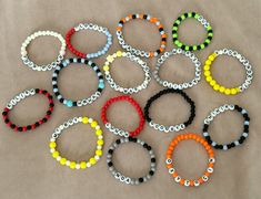 several bracelets with different colors and designs on them