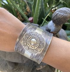 "❋ Handmade Sterling Silver Wide Boho Statement Cuff with Engraved Oxidized Silver Solar Mandala ❋ Dimensions: Width: About 1.5\" (3.8 cm), Length: About 6.9\" / 17.5cm ❋ Metal Purity: 95% Pure Silver (Purer than 925 Sterling Silver) To browse some more of our Silver Jewelry collection you can click on the following links: https://www.etsy.com/shop/SilverShapes Earrings: https://www.etsy.com/shop/SilverShapes?section_id=14809462&ref=shopsection_leftnav_1 Rings: https://www.etsy.com/shop/Silv Hippie Bracelet, Statement Cuff Bracelet, Handmade Silver Jewellery, Cuff Bracelets Handmade, Hippie Bracelets, Bracelet Cuff, Statement Bracelet, Sterling Silver Cuff, Handmade Boho