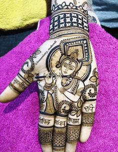 the hand is decorated with henna designs