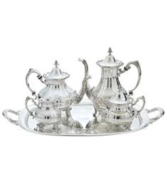 two silver tea set on a tray