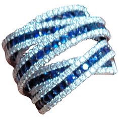 three blue and white crystal hair clips on a white background with clippings in the middle