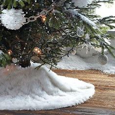 a christmas tree with snow on the ground