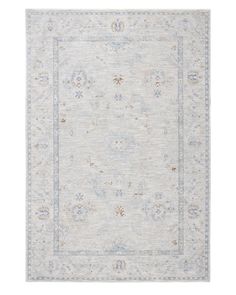 a white rug with blue and beige accents on the bottom, in front of a white background