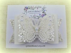 The bow is made from chunky glitter fabric, faux leather and lace butterfly, bows size is about 3 1/2 ( 9 cm) Can be attached to: A thin 3mm beige headband A one size fits all nylon white headband A regular 15mm white headband An alligator hair clip with non slip grip Ready to ship in 3 to 5 Beige Headband, Baby Glitter, Sparkly Hair, Lace Butterfly, Fancy Bows, Alligator Hair Clip, Toddler Hair Bows, Butterfly Bow