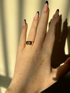 a woman's hand with a ring on it