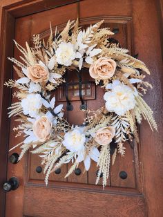 a wreath is hanging on the front door