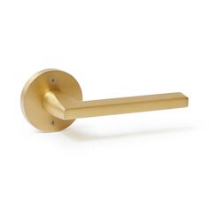 a brass door handle on a white background