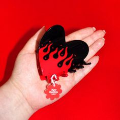 Our New Heights Studio's original design, the "Fury" hair claw, now has an evil twin sister! "Dark Fury" is one of our Halloween hair claw designs that captures a gothic vibe with a nod to Y2K fashion. ❤️🔥 This is a glossy, heart-shaped accessory in black with vibrant red flames, and adorned with red rhinestones that sparkle like hot embers. Whether you're heading to a concert or a witch's market, or celebrating a Scorpio bestie's birthday, "Dark Fury" is your go-to for a standout look. It also Gothic Hair, Red Flames, Scorpio Birthday, Bestie Birthday, Gothic Hairstyles, Y2k Accessories, Evil Twin, Heart Hair, Halloween Hair