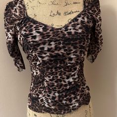 Animal Print Short Sleeve Top Lined With Center Rouching And Sweetheart Neckline. Never Worn Fits Snug. Size M But Fits Like A Small. Fitted Leopard Print Blouse For Summer, Summer Fitted Leopard Print Blouse, Fitted Leopard Print Summer Blouse, Fitted Leopard Print Blouse For Night Out, Fitted Leopard Print Blouse With Short Sleeves, Cute Short Sleeve Tops With Bear Print, Coffee-colored Graphic Print Short Sleeve Top, Candy Brown, Cotton Tiger Print Short Sleeve Top