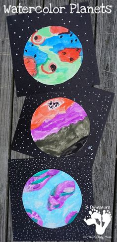 three watercolor planets on black paper with text overlay that says, watercolor planets