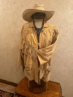 Deerskin fringed frontier jacket.  Unisex- Large (loose fit) Measurements: Shoulder to Shoulder front- 20 inches  Back- 21 inches  Collar to bottom- 32 inches  Midsection 47 inches -all around. Fringe Outerwear For Fall Festival, Western Tassel Outerwear For Fall, Vintage Fall Outerwear For Western-themed Events, Deerskin Jacket, Winter Outerwear With Beaded Fringe And Long Sleeves, Bohemian Long Sleeve Outerwear For Rodeo, Bohemian Brown Outerwear For Rodeo, Long Sleeve Outerwear With Tassels For Rodeo, Bohemian Festival Outerwear With Beaded Fringe