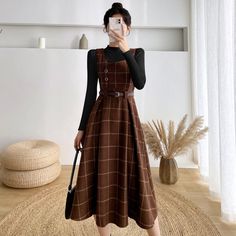 Knit plaid midi dress with thick shoulder straps, sweetheart neckline, side button details and belted waist. Structured pleated skirt with side cutouts. Concealed back zipper. Layer it with the Basic Turtleneck Sweater. S: 26" waist, 41" lengthM: 27.5" waist, 41" lengthL: 29" waist, 41" lengthXL: 30.5" waist, 41" length Vintage Core Outfits, Academia Wardrobe, Capsule 2023, Dark Academia Dress, Dark Academia Dresses, Plaid Sweater Dress, Preppy Mode, Teacher Aesthetic, Woolen Dresses