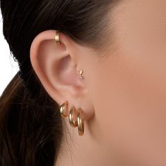 "Gold Cartilage Ring - Solid 14kt gold bold helix piercing cuff earring Bold while minimalist, this gold cartilage ring is a classic, timeless design you can go everywhere and anyhow with. It'll just be there, shiny and beautiful, making you radiant. Get it now! Enjoy a volume discount that grows with the number of items, ranging from 5% to 15% off the single item price. Materials: ♦ 14 karats nickel-free gold in yellow gold, rose gold, or white gold. Sizing: ♦ Gauge: 18 gauge or 16 gauge (1mm o Nose Ring Hoop Gold, Gold Helix Earrings, Nose Ring Gold, Hoop Nose Ring, Gold Nose Hoop, Diamond Nose Ring, Nose Ring Hoop, Gold Nose Ring, Nostril Piercing