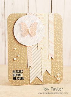 a close up of a card with a bow and ribbon on the front that says, blessed beyond measure