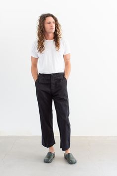 These workwear cotton twill pants feature the following: button fly, high rise, belt loops, coin pocket, front pockets, back right pocket with darts. Semi-Wide straight leg. These were originally white workwear chinos, now dyed black. Unisex Fit so the hips are more narrow than modern women's pants. 3.5" blind hem to let out if desired.  Material: 100% Cotton Twill  | Made in the 60s. Garment Dyed in Los Angeles in 2022. Condition: Good with A couple small dark scuffs.   Measurements: 34" Waist / 43" Hips / 11.5" Rise / 13" Thigh / 9.5" Leg Opening / 28" Inseam Elijah is 6'0" with a 30" waist. These could fit a large frame.  SHOP http://www.rawsonstudio.etsy.com FOLLOW US + instagram | @_rawson  + pinterest | rawson *No Returns. Items are eligible for store credit only. We ask that the buy Workwear Chinos, Pant Trouser, Blind Hem, Utility Pants, Twill Pants, Modern Woman, Cotton Twill, Black Cotton, Favorite Outfit