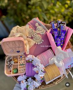 a basket filled with lots of different types of jewelry