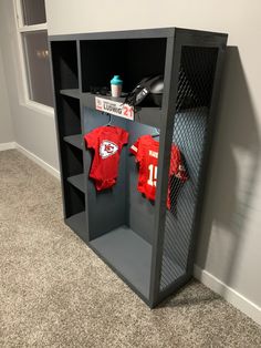 a locker with two jerseys on it in a room