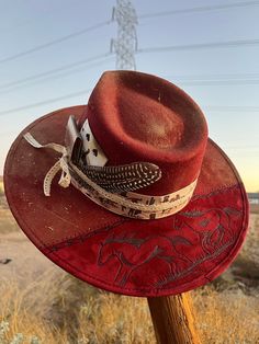 Southwestern Wide Brim Felt Hat For Western-themed Events, Rustic Top Hat With Flat Brim For Country Events, Rustic Fitted Fedora For Country Events, Rustic Fitted Hat For Western-themed Events, Rustic Top Hat With Curved Brim For Country Events, Red Western Hat Bands For Kentucky Derby, Red Western Hat Band For Kentucky Derby, Red Western Style Hat Bands For Kentucky Derby, Southwestern Fitted Hats For Rodeo