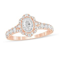 Celebrate every wonderful moment of your love with this vintage-inspired diamond engagement ring. Created in 14K rose gold, this charming style showcases a 1/3 ct. diamond shimmering in a border of intricate milgrain. The scalloped frame and subtly split shank sparkle with multi-sized diamonds. Captivating with 1 ct. t.w. of diamonds and a bright polished shine, this engagement ring is bursting with romantic detail. Rose Gold Oval Diamond Ring For Proposal, Classic Oval Rose Gold Cluster Ring, Oval Rose Gold Diamond Ring With Center Stone, Heirloom Oval Rose Gold Diamond Ring, Classic Oval Cluster Ring In Rose Gold, Heirloom Rose Gold Oval Diamond Ring, Oval Rose Gold Diamond Ring With Halo, Oval 14k Rose Gold Diamond Ring For Wedding, Oval Rose Gold Cluster Ring With Rose Cut Diamonds