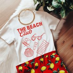 Get ready for sunny days with our soft style t-shirt featuring trendy retro doodles of beach icons like sunglasses, beach towels, beach chairs, and more. With "The Beach Club" proudly displayed, this shirt captures the playful and carefree spirit of beach life. Product Features: -Material: Made from 100% ring-spun cotton, this lightweight fabric (4.5 oz/yd² or 153 g/m²) ensures a comfortable wear all year round. -Design: The retro doodles and distressed printing give the t-shirt a unique, vintage appeal that's perfect for beach lovers. Fit: With a classic fit and crew neckline, this shirt offers a clean, versatile style suitable for any occasion, whether casual or semi-formal. -Durability: The shoulders feature twill tape for improved durability, and the ribbed knitting on the collar preve Retro Doodles, Sunglasses Beach, The Beach Club, Beach Icon, Girls Shirt, Coconut Girl, Club Shirts, Girl Shirt, Beach Themed