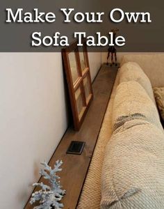 a couch sitting on top of a wooden floor next to a white wall with the words make your own sofa table