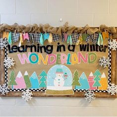 a bulletin board with snowmen and trees on it that says learning n'winter wonderland