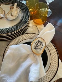 the table is set with plates, silverware and napkins for dinner guests to enjoy