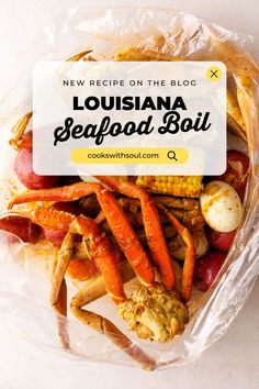 a bag full of crab legs and carrots with text overlay reading new recipe on the blog louisiana seafood boil