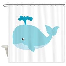 a shower curtain with a blue whale on it