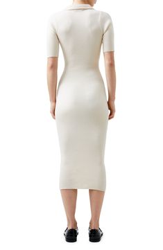 A ribbed knit adds texture to this slim-fitting sweater-dress designed with a jaunty collar and a midi length. 47 1/2" length (size Medium) Slips on over head Johnny collar Elbow-length sleeves 50% viscose, 34% polyester, 16% nylon Unlined Dry clean or hand wash, dry flat Imported Elegant Ribbed Knit Bodycon Dress, Fitted Knit Dress In Solid Color, Fitted Knit Solid Color Dresses, Solid Knit Fitted Dresses, Winter Ribbed Knee-length Midi Dress, White Ribbed Knee-length Midi Dress, Stretch Knit Midi Dress Knee-length, Knee-length Stretch Knit Midi Dress, Stretch Knit Knee-length Midi Dress