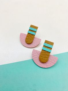 These studs offer a unique but subtle addition to any look. The pink and blue are all finished leather with a slight sheen. The green leather on the green/black pair is suede (unfinished leather).  Earrings are soft and comfortable but are sturdy at the stud back. Material is genuine leather from scrap bags or up-cycled from second-hand shoes, bags, etc. Trendy Multicolor Leather Jewelry, Fimo Leather Effect Jewellery, Leather Strip Earrings, Geometric Leather Earrings, Blue Leather Bohemian Earrings, Boho Chic Design, Earrings Inspiration, Birds Of Paradise, Green Leather