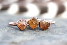 This listing is for one made-to-order raw citrine crystal ring that is outrageously gorgeous, organic, and rustic. I created the ring with a technique called electroforming. Copper is deposited over the stone over 12-24 hours using electrical currents. It creates a gorgeously organic and hefty piece with a setting that looks like animal skin or something pried right out of the earth. The copper has been given a darkened patina that contrasts with beautiful citrine color. Attention: MADE TO ORDER November Birthstone Ring, Copper Crystal, Raw Crystal Ring, Raw Citrine, Raw Stone Ring, Citrine Jewelry, Orange Stone, Electroformed Jewelry, Citrine Stone