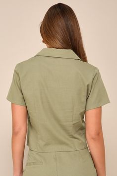 Impressing all day long is easy in the Lulus Complete Vibe Olive Green Cotton Button-Up Short Sleeve Top! Lightweight, linen-like woven cotton shapes this chic shirt that has a collared neckline, short sleeves, and a functional button placket at the front. Darted bodice ends at a slightly cropped hem. Pair with the matching pants for a complete look! Fit: This garment fits true to size. Length: Size medium measures 20" from shoulder to hem. Bust: Great for any cup size. Waist: Loosely Fitted. Un Collared Linen Tops With Buttons, Spring Linen Tops With Collar, Chic Linen Top With Spread Collar, Linen Collared Tops With Buttons, Solid Linen Top For Work, Collared Linen Blouse For Work, Solid Linen Tops For Work, Chic Linen Top With Placket, Summer Tops With Lapel Collar For Day Out