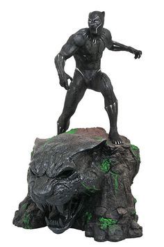 a black panther statue on top of a rock